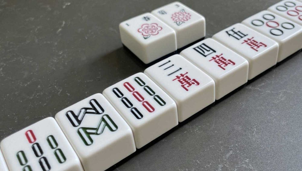 A lineup of mahjong tiles showcasing a winning hand
